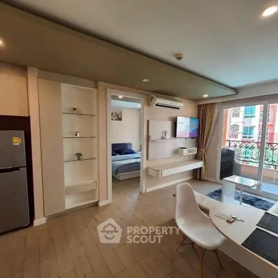 Modern open-plan living room with balcony view and stylish decor