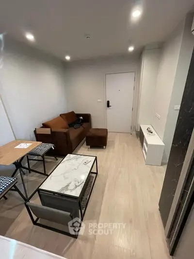 Modern living room with stylish furniture and elegant decor in a cozy apartment setting.