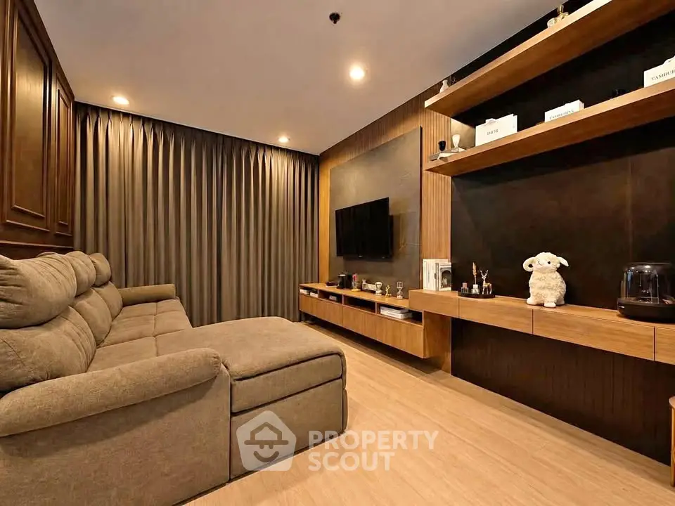 Luxurious living room with modern decor and cozy seating in a stylish apartment.