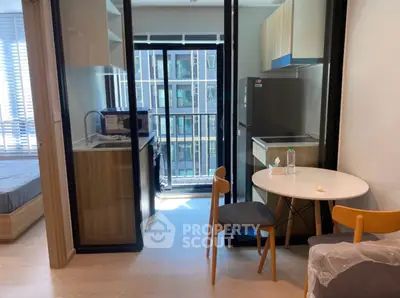 Modern apartment interior with open kitchen and balcony view