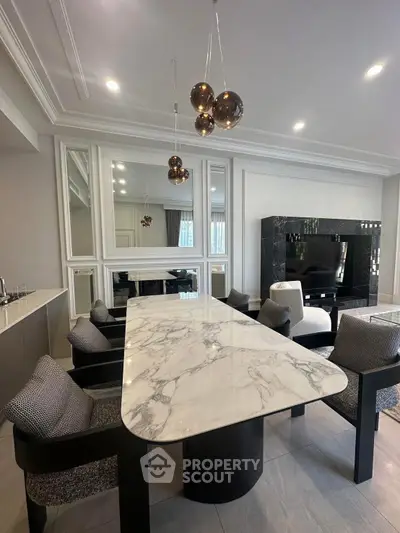 Luxurious modern living room with elegant marble dining table and stylish decor