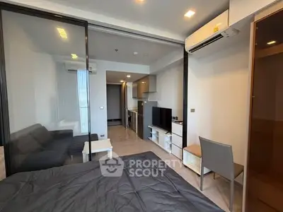 Modern studio apartment with open layout and sleek furnishings