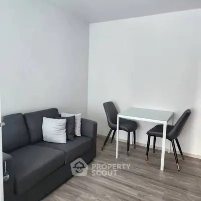 Modern compact living room with sleek furniture and minimalist design