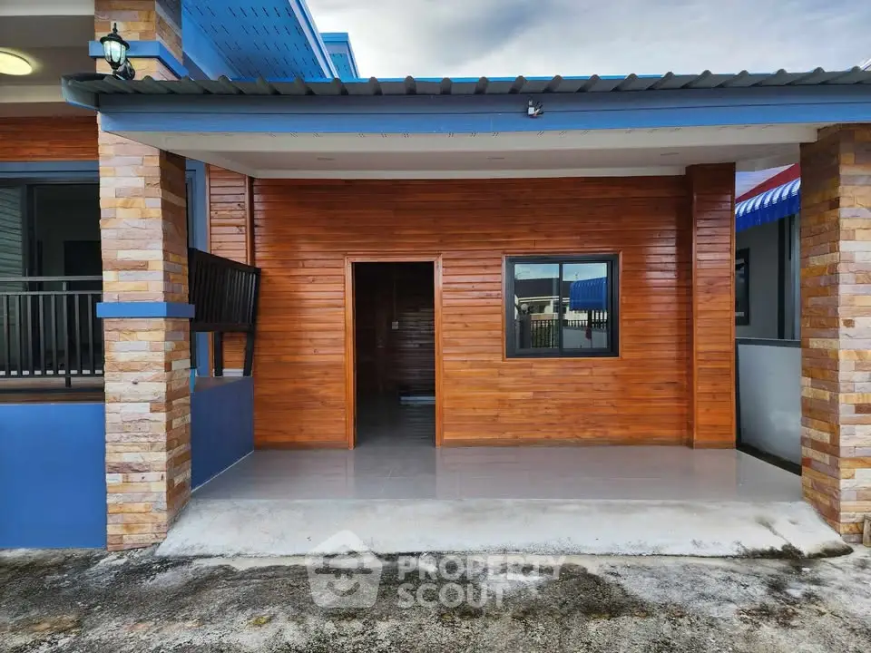 Charming modern house exterior with wooden accents and covered porch