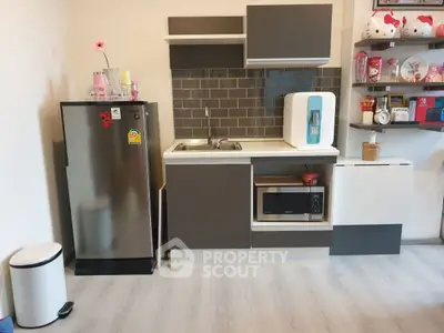 Modern compact kitchen with sleek appliances and stylish shelving