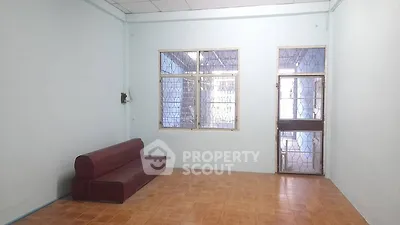 Spacious living room with minimalist design and tiled flooring