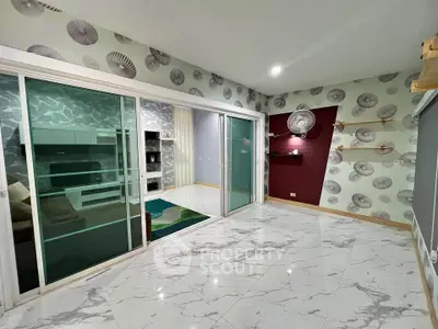 Spacious modern living room with sliding glass doors and stylish decor