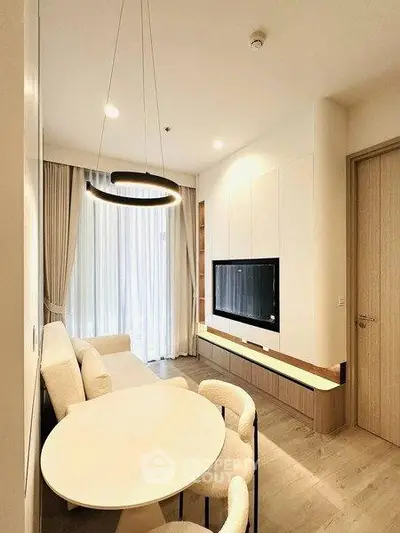 Modern living room with elegant lighting and cozy seating area