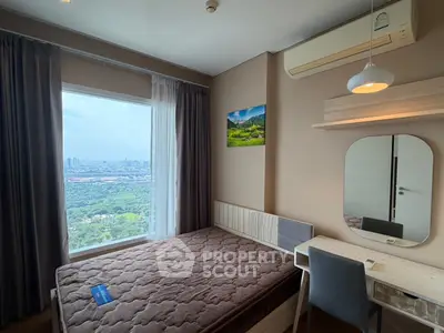 Modern bedroom with stunning city view, featuring a cozy bed, desk, and air conditioning.
