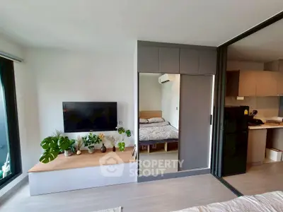 Modern apartment interior with sleek design, featuring a cozy bedroom and stylish living area.
