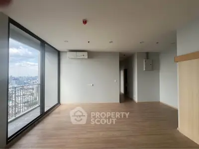 Spacious modern living room with city view and large windows