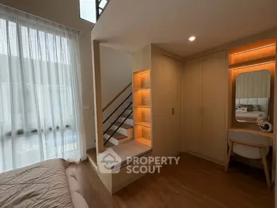Modern bedroom with built-in storage and cozy seating area