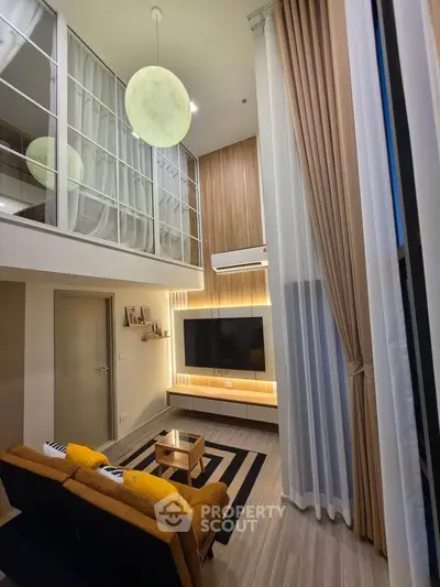 Modern duplex living room with high ceilings and stylish decor