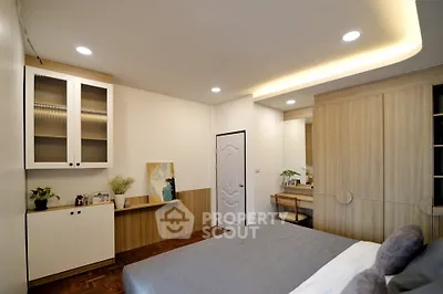 Modern bedroom with stylish wooden furniture and cozy lighting