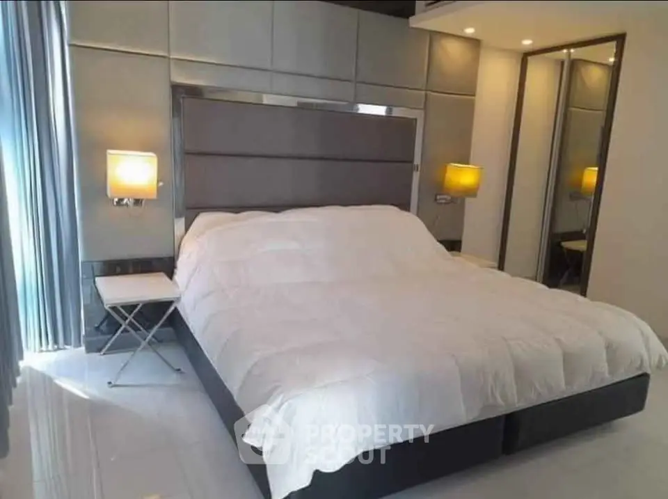 Luxurious bedroom with modern design and elegant lighting
