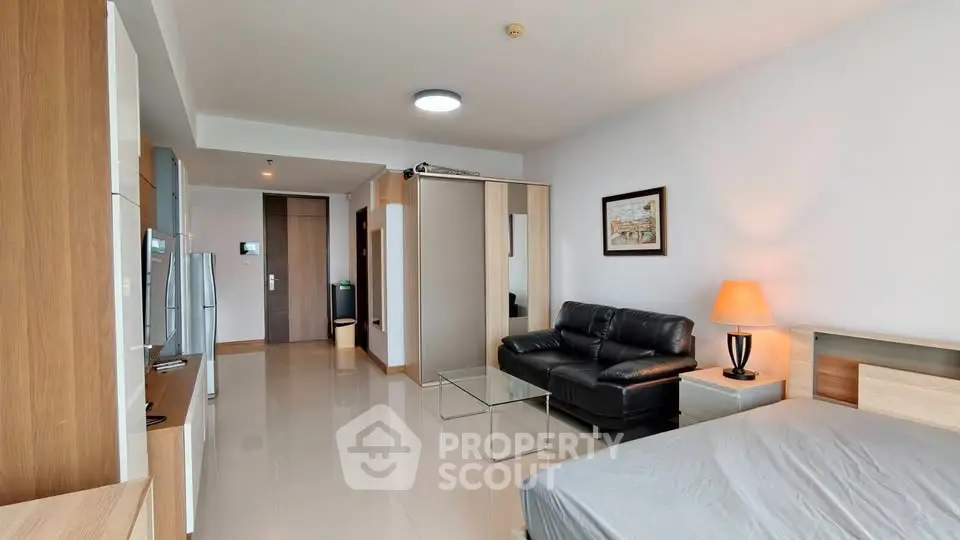 Modern studio apartment with sleek furnishings and open layout