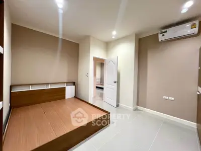 Spacious bedroom with modern design and air conditioning in a stylish apartment.