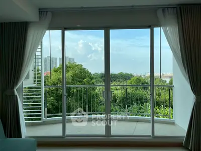 Spacious balcony with stunning green view and city skyline