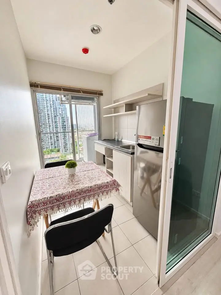 Charming kitchen with city view, featuring modern appliances and cozy dining area.