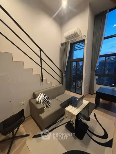 Modern loft apartment with high ceilings and city view