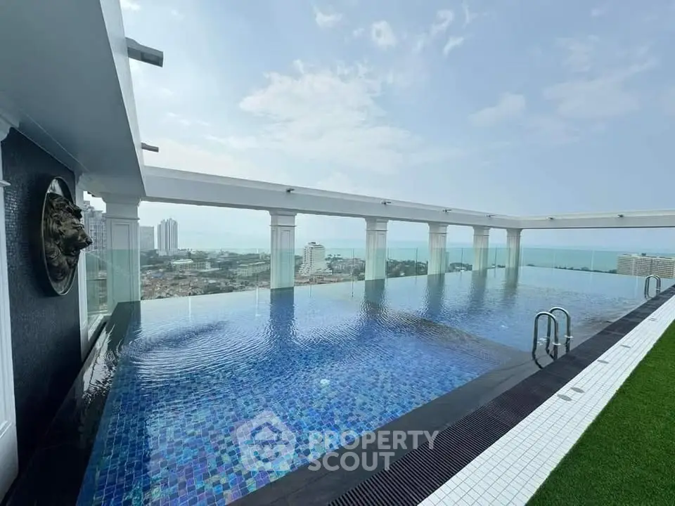 Luxurious rooftop infinity pool with stunning city and ocean views, perfect for relaxation and leisure.