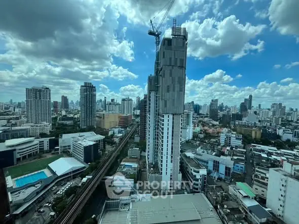 Stunning cityscape view with high-rise buildings and blue sky, perfect for urban living enthusiasts.