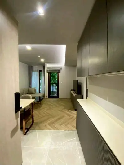 Modern living room with sleek design and balcony view