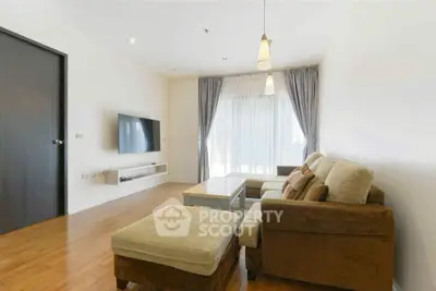 Spacious living room with modern decor and natural light