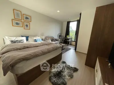 Modern bedroom with cozy decor and large window view
