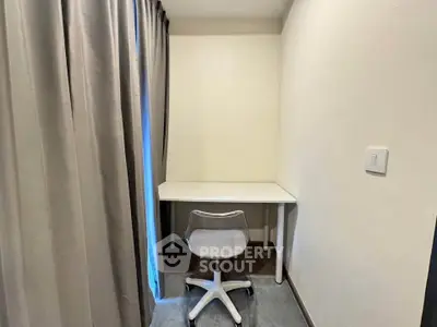 Cozy study nook with desk and chair, perfect for productivity in a compact space.