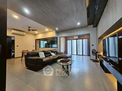 Spacious modern living room with sleek design and large windows