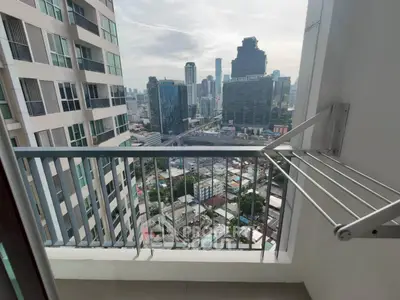 High-rise balcony with stunning cityscape view, perfect for urban living enthusiasts.