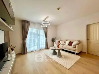 Spacious modern living room with elegant decor and natural light