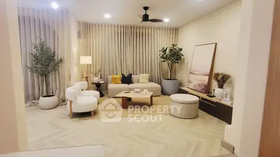 Elegant living room with modern decor, neutral tones, and stylish furniture, perfect for relaxation and entertaining.