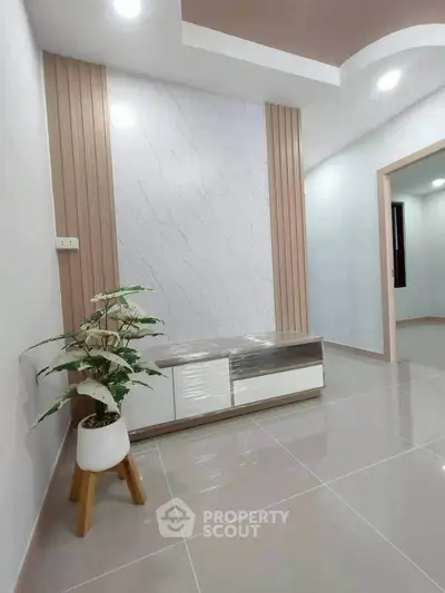 Modern minimalist living room with sleek flooring and stylish decor