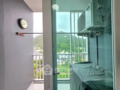 Modern balcony with scenic view and air conditioning unit, perfect for relaxation and enjoying the outdoors.