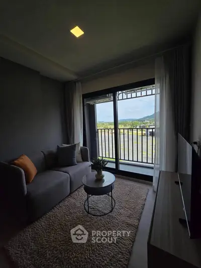 Cozy living room with balcony view in modern apartment