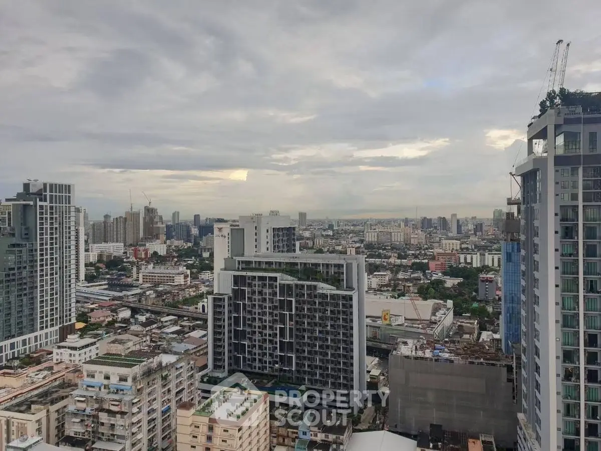Stunning cityscape view from a high-rise building showcasing urban skyline and modern architecture.