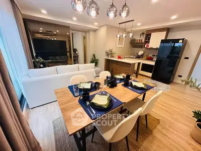 Modern open-plan living and dining area with stylish decor and natural light.