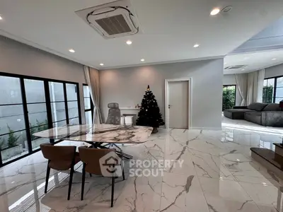 Spacious modern living room with marble floors and Christmas decor