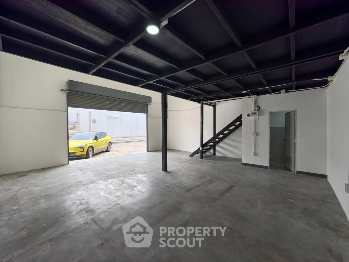 Spacious industrial-style garage with open layout and modern design.