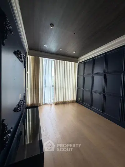 Elegant empty room with dark paneled walls and large window, perfect for customization.