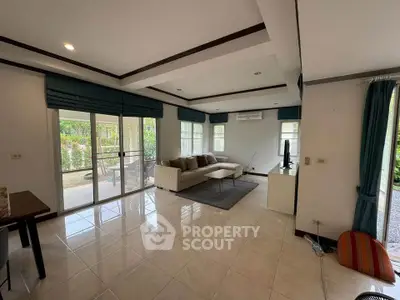 Spacious living room with modern decor and garden view