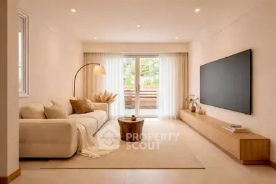 Spacious modern living room with large TV and cozy seating area, perfect for relaxation.