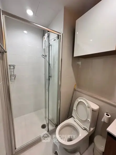 Modern bathroom with glass shower and sleek fixtures