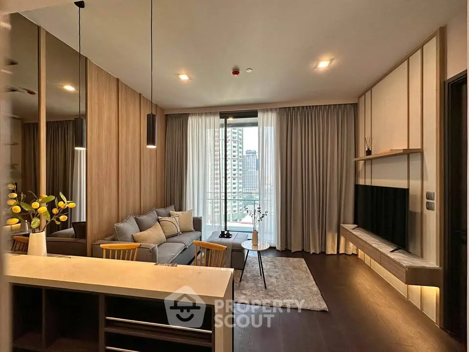 Modern living room with stylish decor and city view from balcony