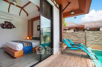 Luxurious bedroom with poolside view and modern design in tropical villa