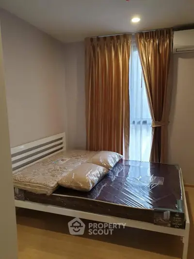 Cozy bedroom with elegant curtains and modern bed frame, perfect for restful nights.