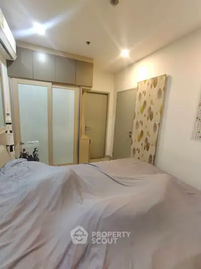 Cozy bedroom with modern decor and ample storage space