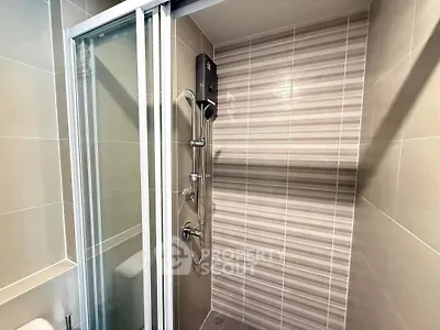 Modern bathroom with sleek shower design and glass sliding door
